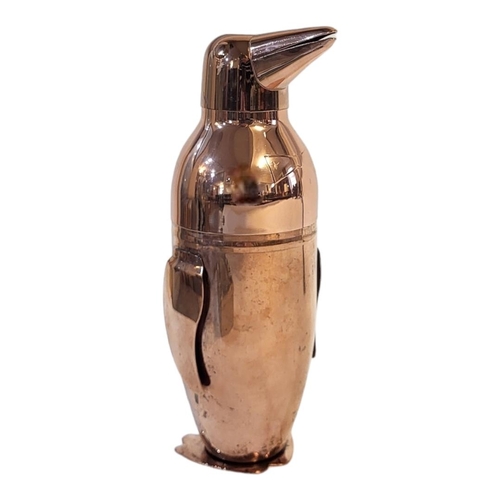 226 - A LATE 20TH CENTURY COPPER COVERED NOVELTY COCKTAIL SHAKER IN DECO MANNER FORMED AS A PENGUIN 
With ... 