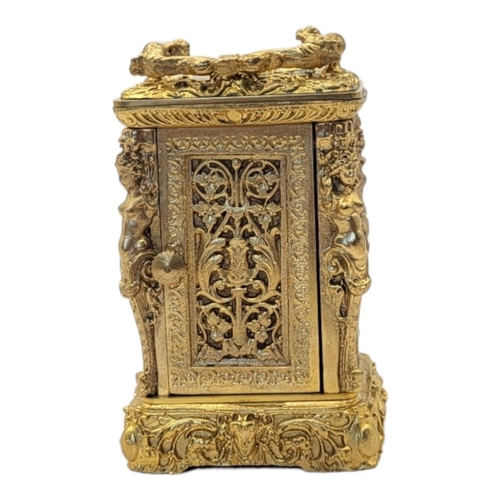 227 - A 19TH CENTURY ROCOCO STYLE GILT BRONZE MINI CARRIAGE CLOCK
Bevelled glass panel to the top revealin... 