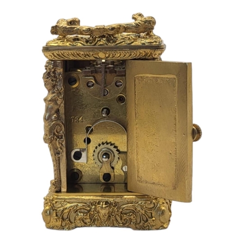 227 - A 19TH CENTURY ROCOCO STYLE GILT BRONZE MINI CARRIAGE CLOCK
Bevelled glass panel to the top revealin... 