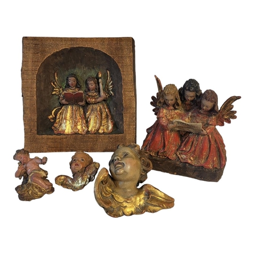 227A - A CONTINENTAL CARVED WOODEN AND DECORATED GROUP
Angelic choir, along with similar plaque and two che... 