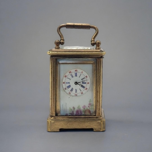 229 - A MINIATURE SÈVRES STYLE FRENCH PORCELAIN AND POLISHED BRASS CARRIAGE CLOCK
Having a glass top with ... 