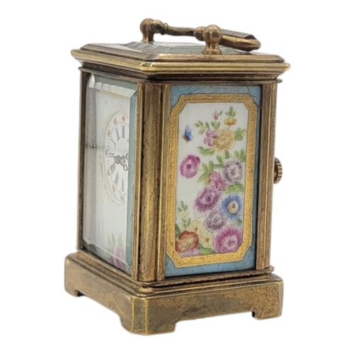 229 - A MINIATURE SÈVRES STYLE FRENCH PORCELAIN AND POLISHED BRASS CARRIAGE CLOCK
Having a glass top with ... 