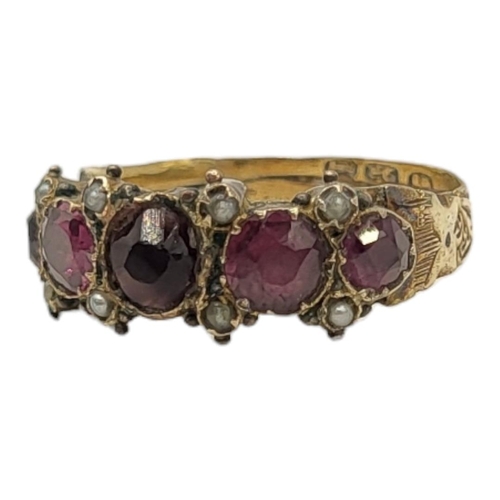 23A - A 19TH CENTURY YELLOW METAL, GARNET AND SEED PEARL RING
Having an arrangement of graduated stones in... 