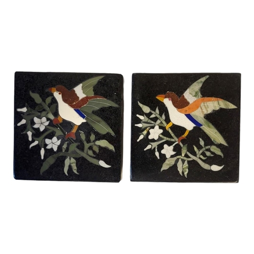 241 - A PAIR OF PIETRA DURA BLACK MARBLE COASTERS
Inlaid with coloured stones providing a bird and floral ... 