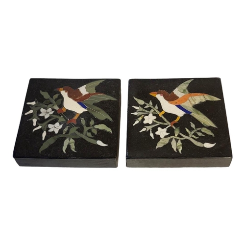 241 - A PAIR OF PIETRA DURA BLACK MARBLE COASTERS
Inlaid with coloured stones providing a bird and floral ... 