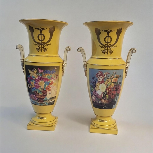 247 - A PAIR OF YELLOW SEVRÈS STYLE CERAMIC VASES
Gilt edging and panels with floral imagery on a tapering... 