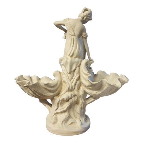 254 - A 19TH CENTURY STYLE PARIAN FIGURE OF SEATED MAIDEN
Flanked by two oyster shells above stylised ocea... 