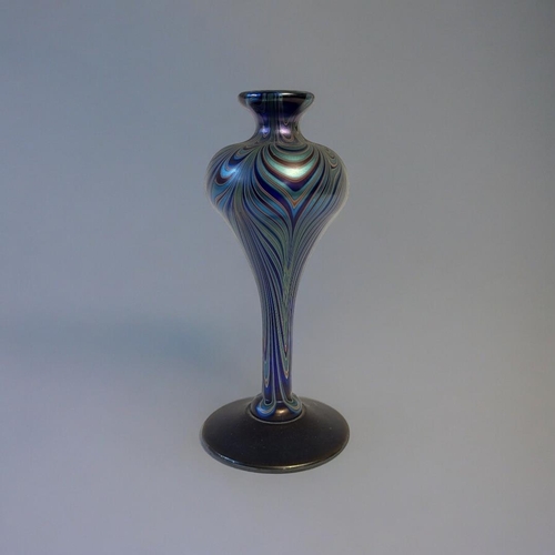 256 - A 20TH CENTURY ART GLASS VASE
Globular form with iridescent decoration, engraved mark to base.
(appr... 