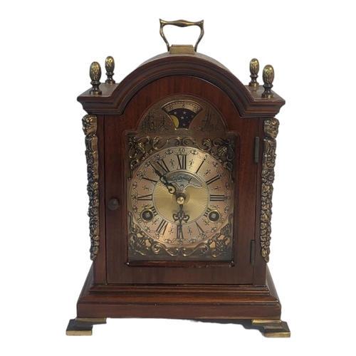 266A - WARMINK, A 20TH CENTURY MAHOGANY AND BRASS MANTEL CLOCK
Single brass handle with acorn finials and b... 