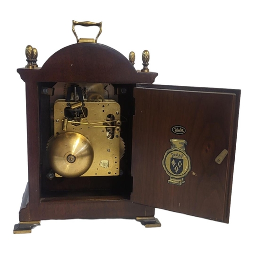 266A - WARMINK, A 20TH CENTURY MAHOGANY AND BRASS MANTEL CLOCK
Single brass handle with acorn finials and b... 