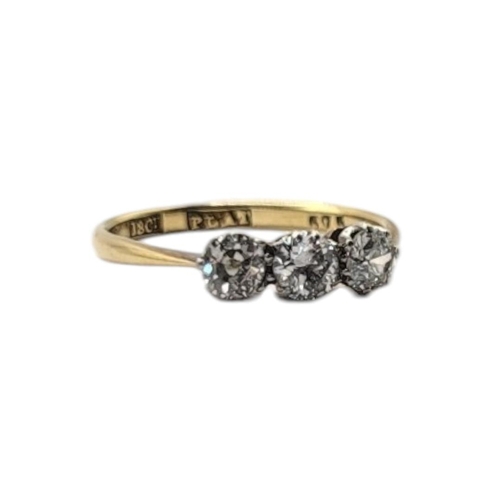 27 - AN EARLY 20TH CENTURY 18CT GOLD AND DIAMOND THREE STONE RING
Having a row of round cut diamonds in a... 