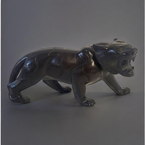 277 - A MEIJI STYLE BRONZED TIGER FIGURE
Having indented groove decoration marking its stripes. 
(9cm x 26... 