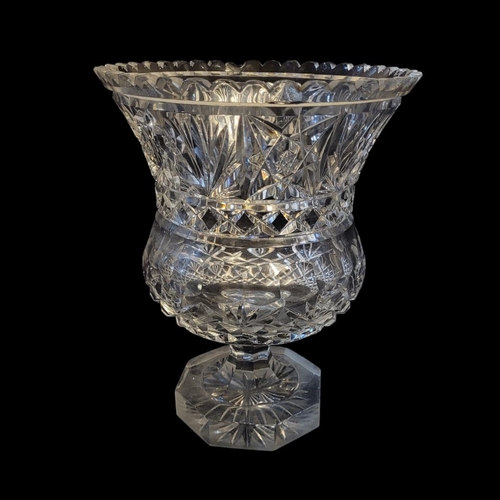 280 - A LARGE 20TH CENTURY CUT LEAD CRYSTAL VASE 
Campagne form with star cuts and flutes on octagonal bas... 