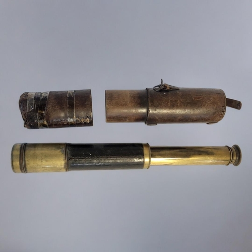 284 - A 19TH CENTURY BRASS AND LEATHER TELESCOPE 
Three pull out and lens shade,black leather mount and ou... 