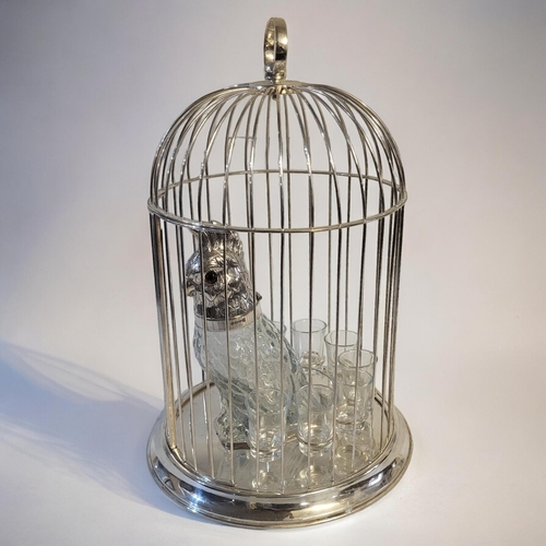 289 - A SILVER PLATE BIRDCAGE DECANTER SET
Centrally positioned clear glass and silver plated parrot decan... 