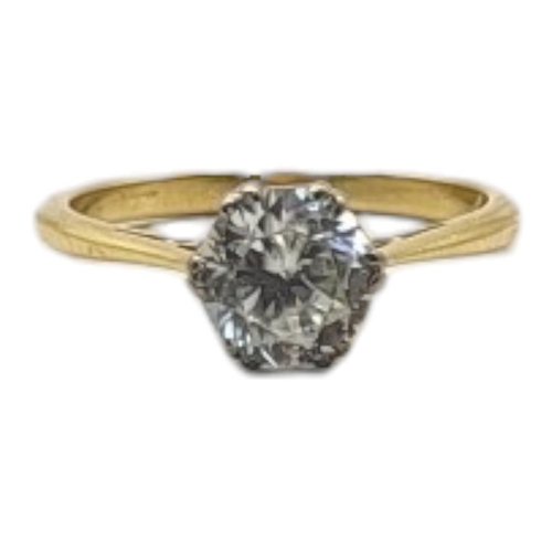 29 - A VINTAGE 18CT GOLD AND QUARTZ SOLITAIRE RING
The single round cut stone in a plain design.
(size J)... 