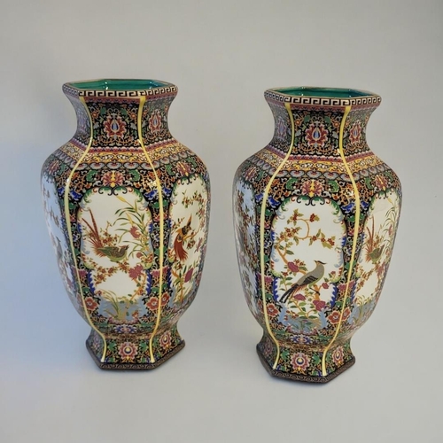 292 - A PAIR OF CHINESE STYLE FAMILLE VERTE HEXAGONAL BALUSTER VASES
With floral decoration and stylised b... 