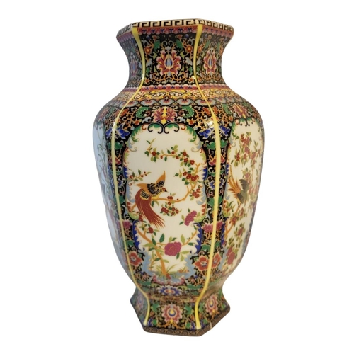 292 - A PAIR OF CHINESE STYLE FAMILLE VERTE HEXAGONAL BALUSTER VASES
With floral decoration and stylised b... 