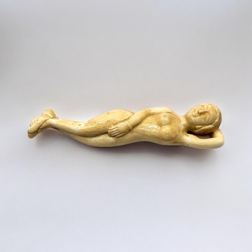 304 - A 19TH CENTURY CHINESE STYLE BONE DOCTORS FIGURE
Nude woman lying in recumbent position. 
(13cm)

Co... 