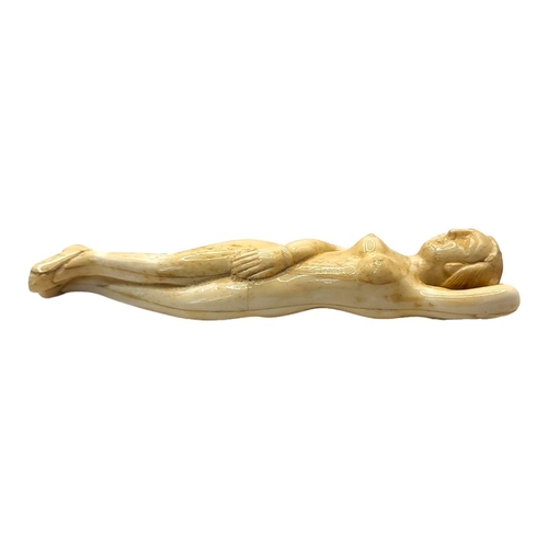 304 - A 19TH CENTURY CHINESE STYLE BONE DOCTORS FIGURE
Nude woman lying in recumbent position. 
(13cm)

Co... 