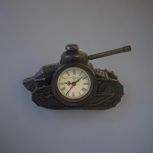 309 - A BRONZE EFFECT METAL CLOCK
Taking the form of an early 20th Century tank with turret. 
(15cm x 5cm ... 