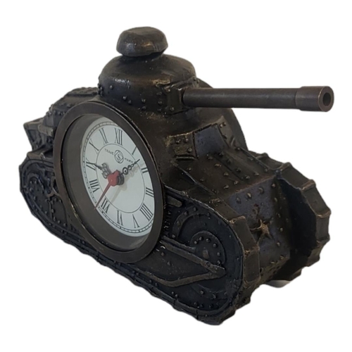 309 - A BRONZE EFFECT METAL CLOCK
Taking the form of an early 20th Century tank with turret. 
(15cm x 5cm ... 