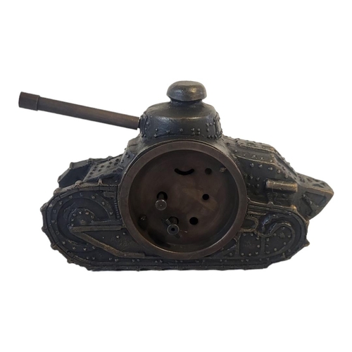 309 - A BRONZE EFFECT METAL CLOCK
Taking the form of an early 20th Century tank with turret. 
(15cm x 5cm ... 