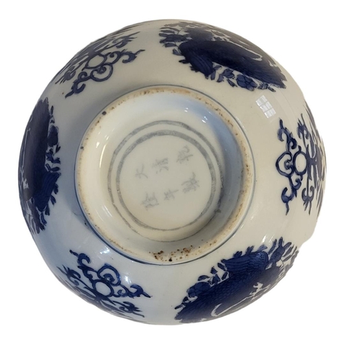 317 - A 19TH CENTURY CHINESE STYLE  BLUE AND WHITE FOOTED BOWL
With entwined phoenix and lotus decoration,... 