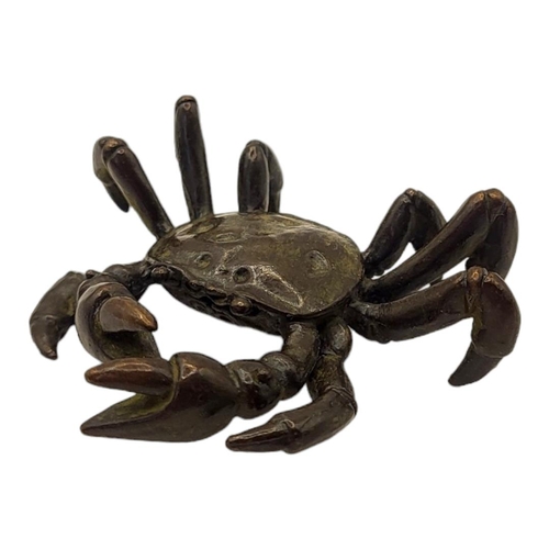 318 - A JAPANESE STYLE BRONZE FRESHWATER CRAB
With impressed logographic characters to base.

Condition: g... 