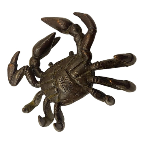 318 - A JAPANESE STYLE BRONZE FRESHWATER CRAB
With impressed logographic characters to base.

Condition: g... 