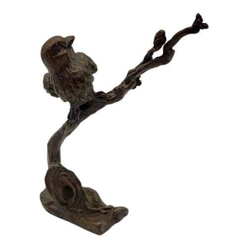 319 - A JAPANESE STYLE BRONZE BIRD ON FLOWERING CHERRY BLOSSOM BRANCH
Impressed logographic characters to ... 