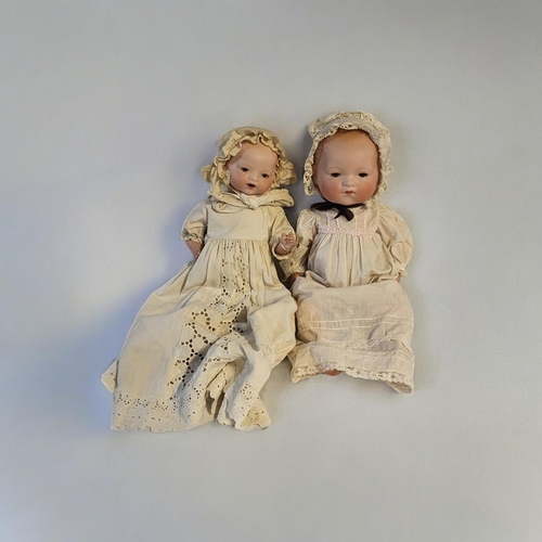 328 - HEUBACH BROTHERS, GEBRUDER HEUBACH, A BISQUE HEADED BEBE DOLL 
Five piece jointed composition body, ... 