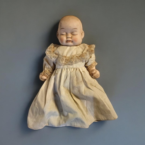 344 - AN UNUSUAL GERMAN DOUBLE FACED BISQUE HEADED CHARACTER BEBE BYE-LO DOLL
(possibly Gebruder Heubach),... 