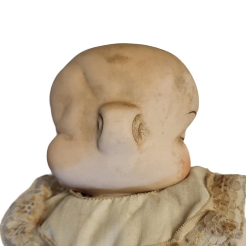 344 - AN UNUSUAL GERMAN DOUBLE FACED BISQUE HEADED CHARACTER BEBE BYE-LO DOLL
(possibly Gebruder Heubach),... 