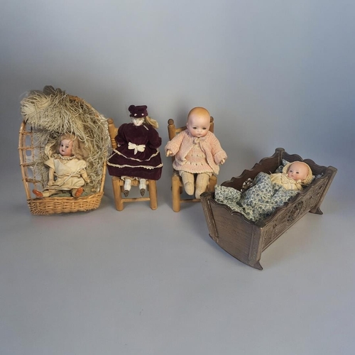 349 - ARMAND MARSEILLE, A NOVELTY BISQUE HEADED DOLL
In original Thuringian black forest wooden cradle, Ci... 