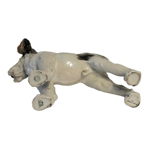 352 - A FRENCH HARD PASTE PORCELAIN MODEL OF A TERRIER DOG, CIRCA 1930 - 1950
In standing position, moulde... 