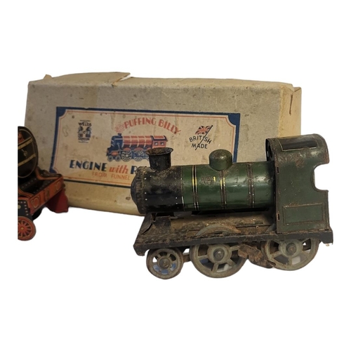 356 - A 1930’S BOXED PUFFING BILLY TINPLATE PAINTED CLOCKWORK MODEL OF LOCOMOTIVE BY WELLS OF LONDON
With ... 