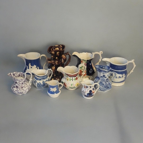 369 - A COLLECTION OF EARLY 19TH CENTURY STAFFORDSHIRE POTTERY JUGS
Comprising a treacle glazed Toby jug o... 