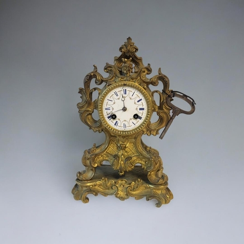 371 - DELETTREZ, A FRENCH 19TH CENTURY GILT BRASS MANTLE CLOCK
Rococo form with scrolled case and white en... 