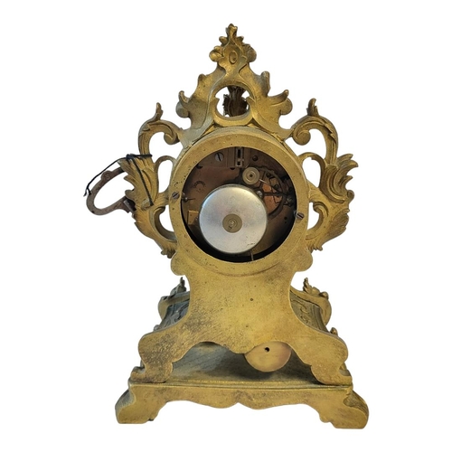 371 - DELETTREZ, A FRENCH 19TH CENTURY GILT BRASS MANTLE CLOCK
Rococo form with scrolled case and white en... 