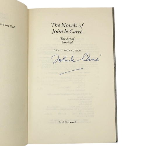 410 - DAVID MONAGHAN, THE NOVELS OF JOHN LE CARRÉ, SIGNED, 1985
Dust jacket worn to edges.