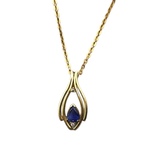 50 - A VINTAGE 18CT GOLD, SAPPHIRE AND DIAMOND PENDANT NECKLACE
The pear cut Sri Lanka/Ceylon sapphire se... 