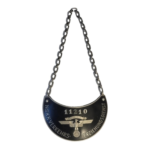 524 - A GERMAN NSKK GORGET, BEARING THE NUMBER 11210 
With eagle and swastika 'NSKK VERKEHS ERZIEHUNGSDIEN... 