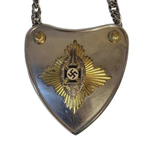 526 - A GERMAN NSKOV STANDARD BEARERS GORGET
Heart form, with raised edge and steel chain.
(approx 14cm x ... 