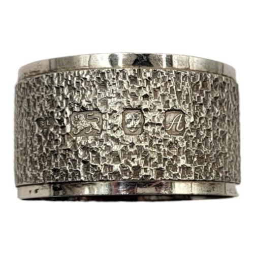 6 - BRIAN LESLIE FULLER, A SET OF SIX MID CENTURY SILVER SERVIETTE RINGS
Having a textured bark effect, ... 