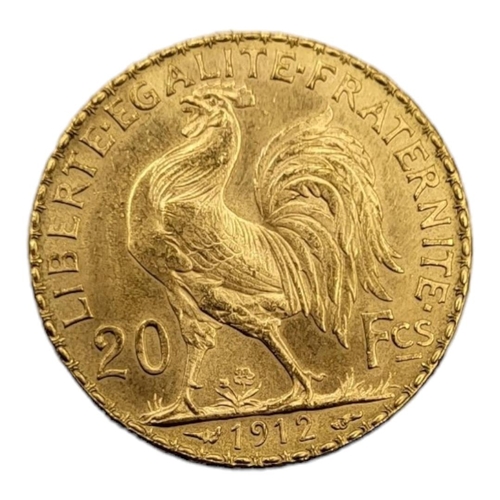 66 - AN EARLY 20TH CENTURY FRENCH 22CT GOLD 20 FRANC COIN, DATED 1912
Bearing a bust of Marianne Goddess ... 