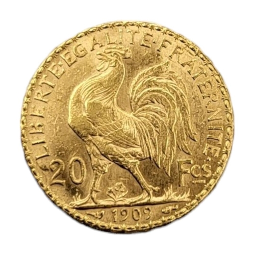 67 - AN EARLY 20TH CENTURY FRENCH 22CT GOLD 20 FRANC COIN, DATED 1909
Bearing a bust of Marianne Goddess ... 