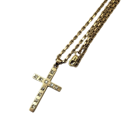 88 - A VINTAGE 9CT GOLD AND DIAMOND CRUCIFIX NECKLACE
Having a row of round cut diamonds in a fine link n... 