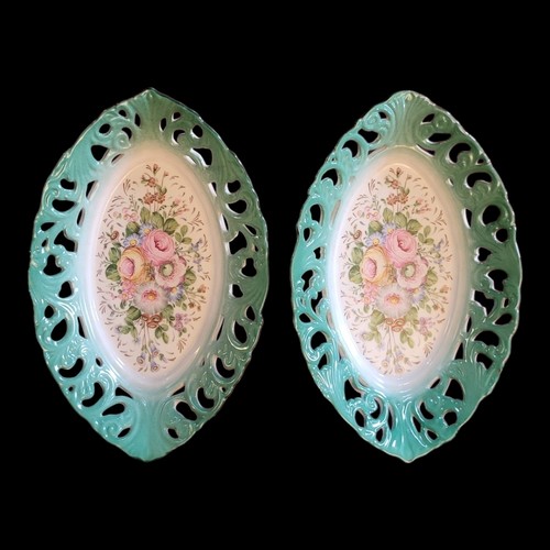 316 - A PAIR OF SEVRÈS STYLE CERAMIC OVAL DISHES
having a central floral decoration and pierced acanthus d... 