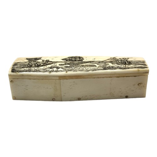 316A - A 19TH CENTURY STYLE BONE SCRIMSHAW TRINKET BOX
In shape of a coffin, with etched whaling scene to l... 